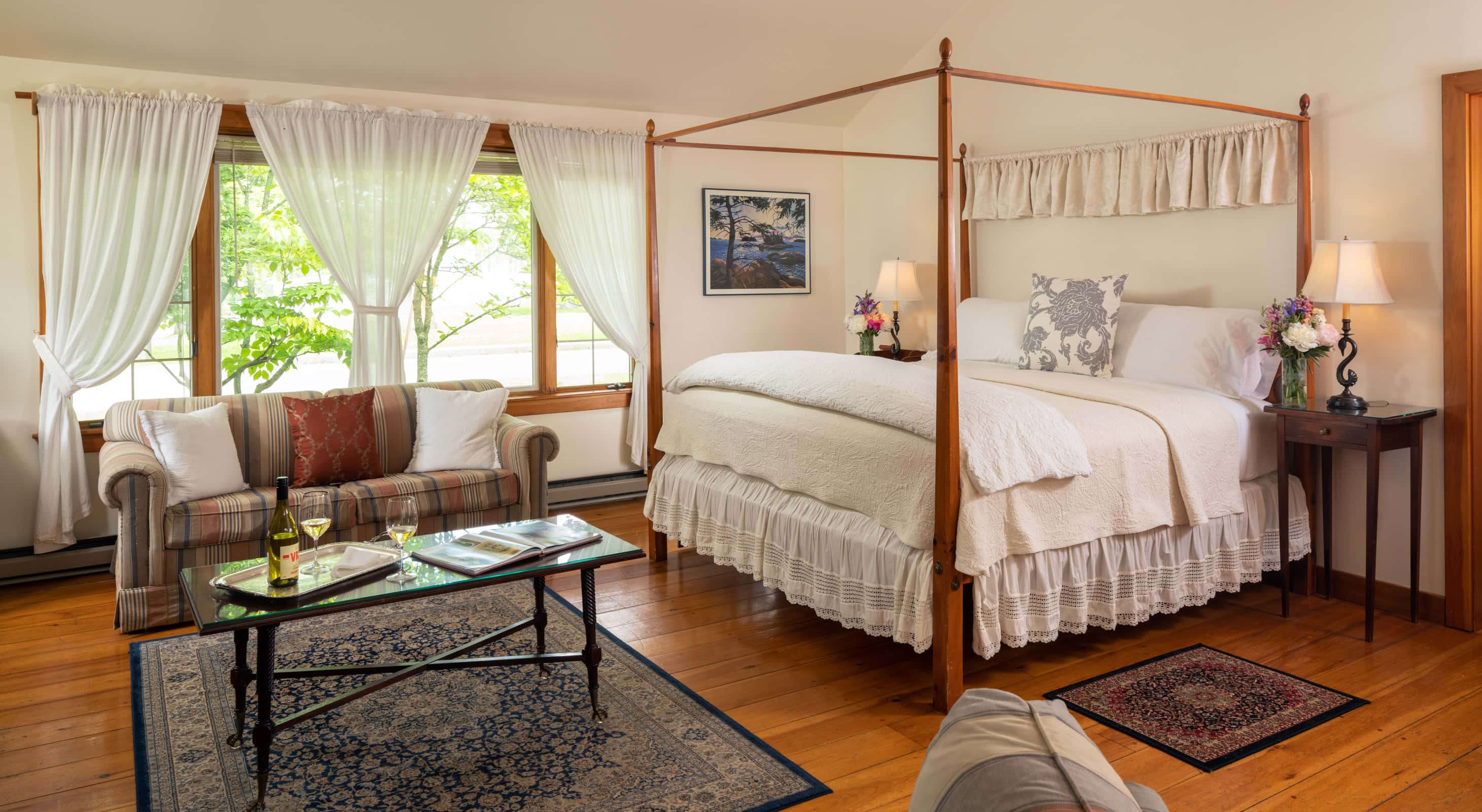 King bed in the Cape House Suite with a large seating area