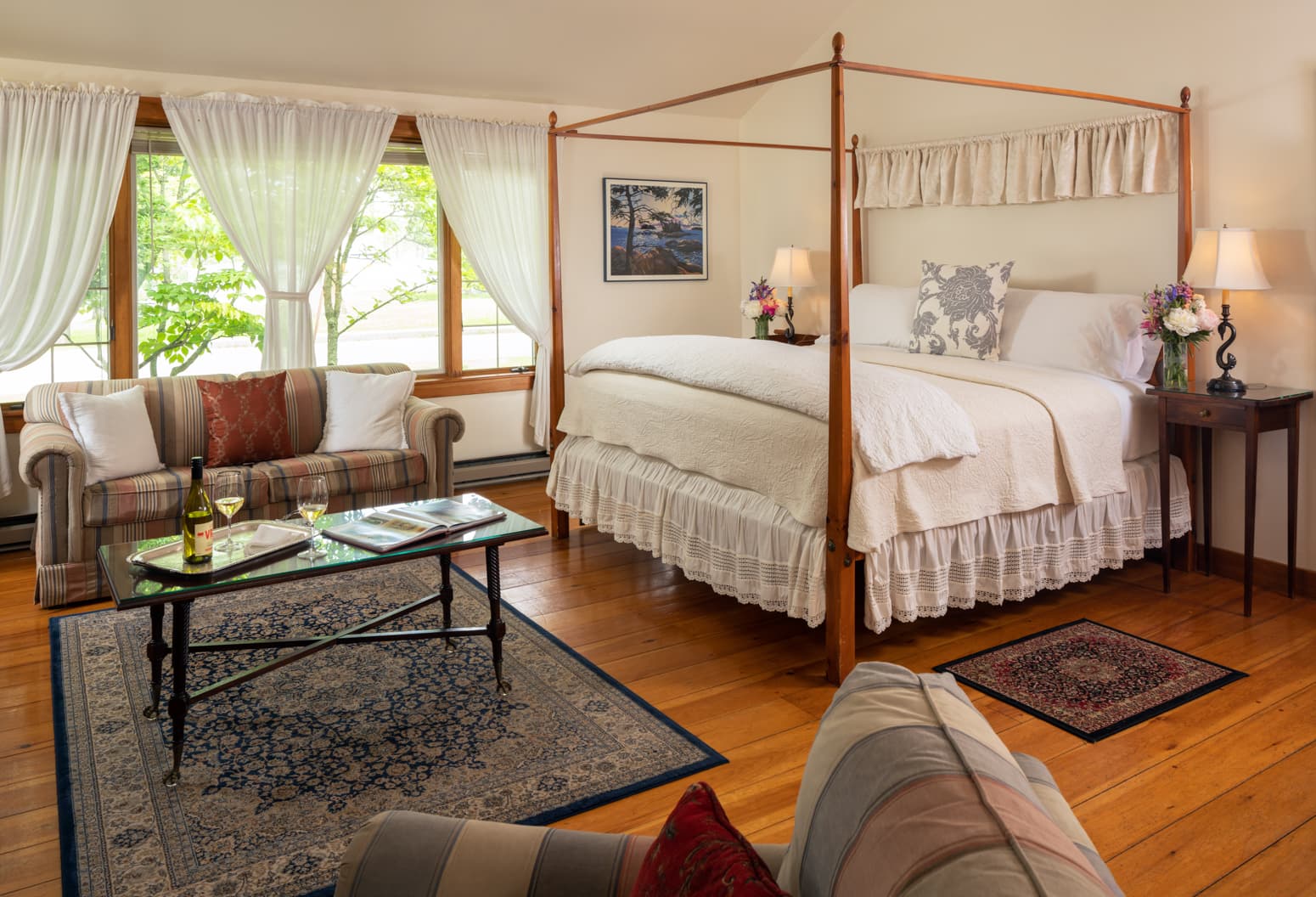 King bed in the Cape House Suite with a large seating area