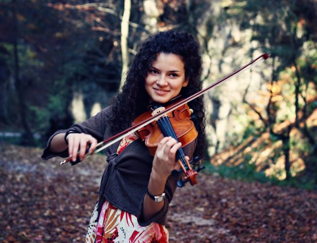 A woman playing a violin
