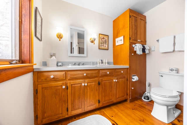 Cape House studio bathroom with full countertop and tub shower combination
