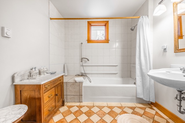 Cape House Suite accessible bathroom with sink and dressing table